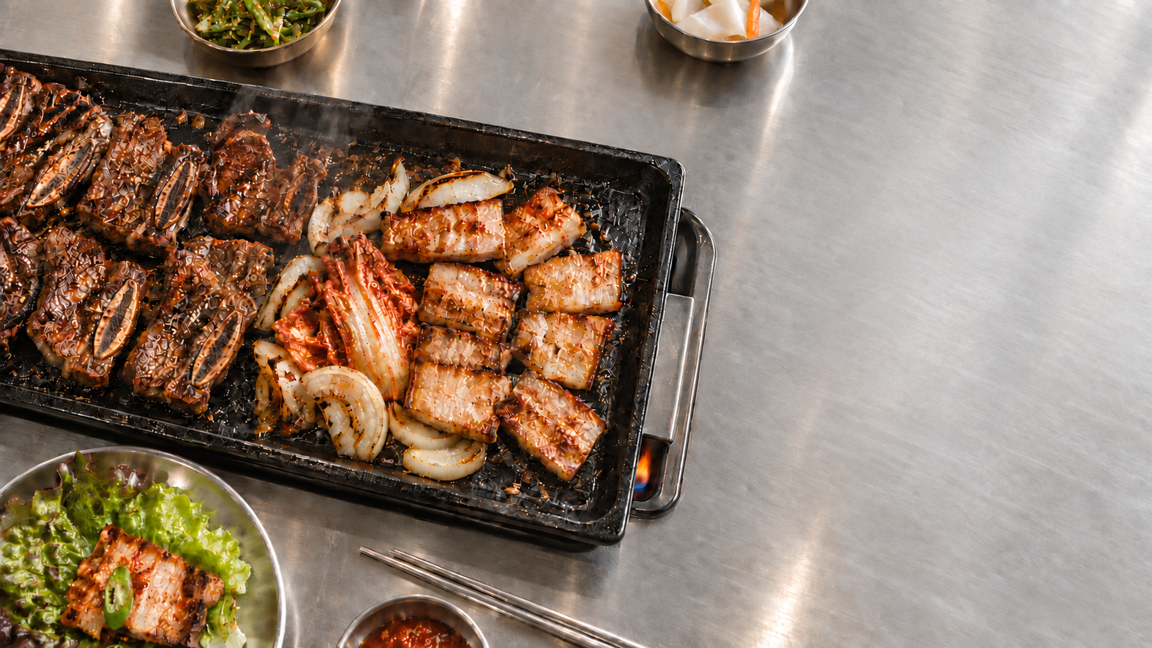 Korean barbecue on a stainless steel table